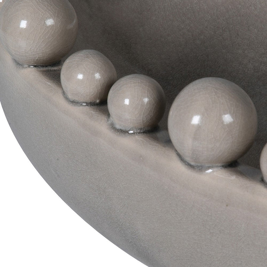 Elegant Cream Oval Ceramic Bowl with Decorative Rim Balls